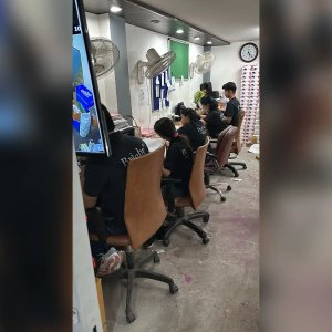 Employees at Desk in Bright Corporate Office