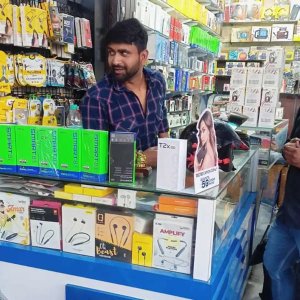 Happy Customer With Shopkeeper
