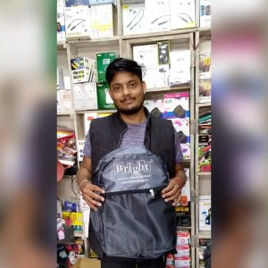 Happy Retailer Holding Branded Backpack