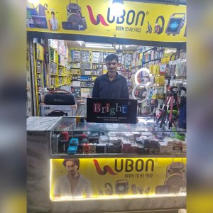 Happy Shopkeeper Posing With Mobile Accessories