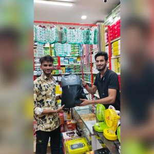 Promotional Backpack Handover to Retail Partner