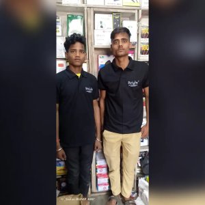 Store Staff Wearing Branded Black Polo T-Shirts